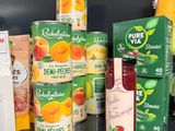 many different types of juices on the counter