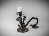 a candle that is sitting on a stand with a candle