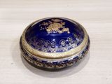 a blue and gold box sitting on a table