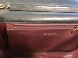 the inside of a chanel handbag with a zipper on it