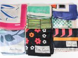 several different types of scarves laid out on a white surface