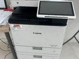 a printer sitting on top of a desk next to a printer