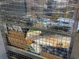 a metal cart with many boxes of food in it