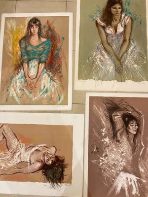 four different colored drawings of a woman laying on a bed