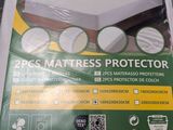the packaging of the mattress protector is on the table