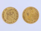 two gold sovereigns, one of which has a head of a man and the other of a woman