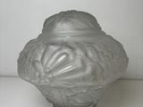 an image of a glass jar with a lid on a white surface