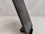 a tablet that is sitting on a stand on a table