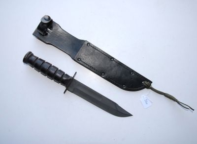 a knife that is laying on a table next to a knife