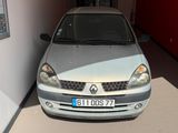 a picture of a silver car parked in a garage