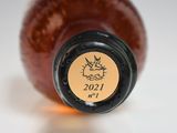 a close up of a bottle of wine with a sticker on it