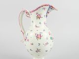 an image of a white and pink vase with flowers on it