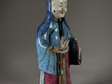 an image of a figurine of a woman in a blue dress