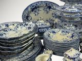a lot of blue and white plates and cups and saucers