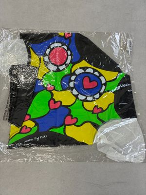 a kite that is wrapped in plastic on a table