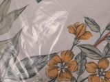 a close up of a plate with a flower design on it