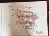 an open book with a drawing of a man and a woman on it
