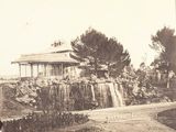 a black and white photo of a gazebo in a park