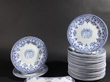 a set of six blue and white plates with floral designs