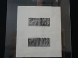 a picture of a picture of an e on display in a glass case