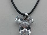 silver plated crystal bear pendant on black cord necklace