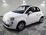 a picture of a small white car on a checkered floor