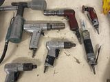a lot of tools that are sitting on a table