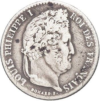 a silver coin with an image of a man on it