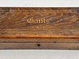 an old wooden box with the word gans written on it