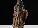 an old statue of a woman with a veil on her head