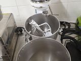 two mixers that are sitting on a kitchen counter