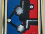 une image d'un tableau sur le mur d'une pièce