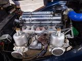 a small engine in the back of a blue car