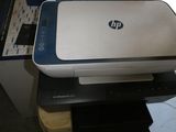 a printer that is sitting on top of a box