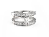 a close up of a diamond ring on a white background