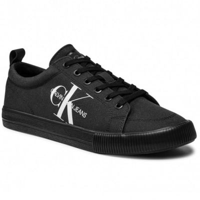 black sneakers with white logo on the side and black laces
