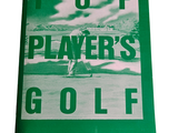 a green book with a picture of a man playing golf