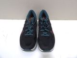 black and blue running shoes on a white surface with a white background