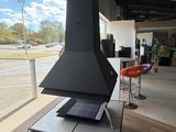 a laptop sitting on top of a table in front of a window