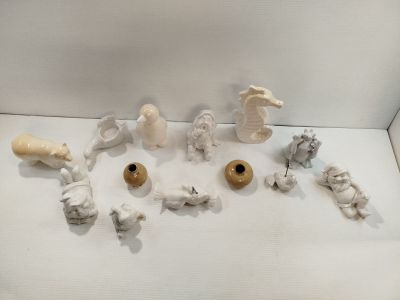 a lot of figurines that are sitting on a table