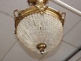 a chandelier hanging from the ceiling in a room