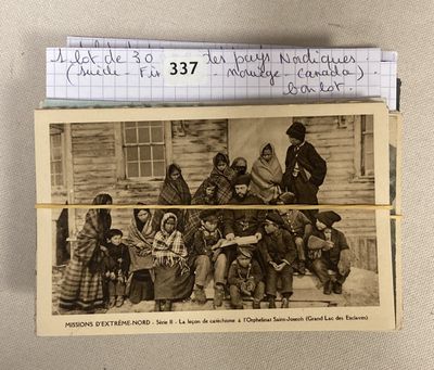 an old photo of a group of people in front of a house