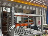 a rack with a bunch of items on it in a warehouse
