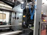 a machine that is working on a piece of metal