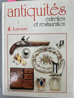 an old book with a bunch of antiques on it