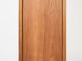 a wooden cabinet with a door on the side