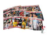a lot of sports magazines on a white surface