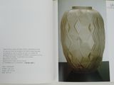 an open book with a picture of a vase on it
