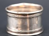 a close up of a silver ring on a table