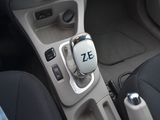 a close up of a car ' s gear lever with the word ze on it